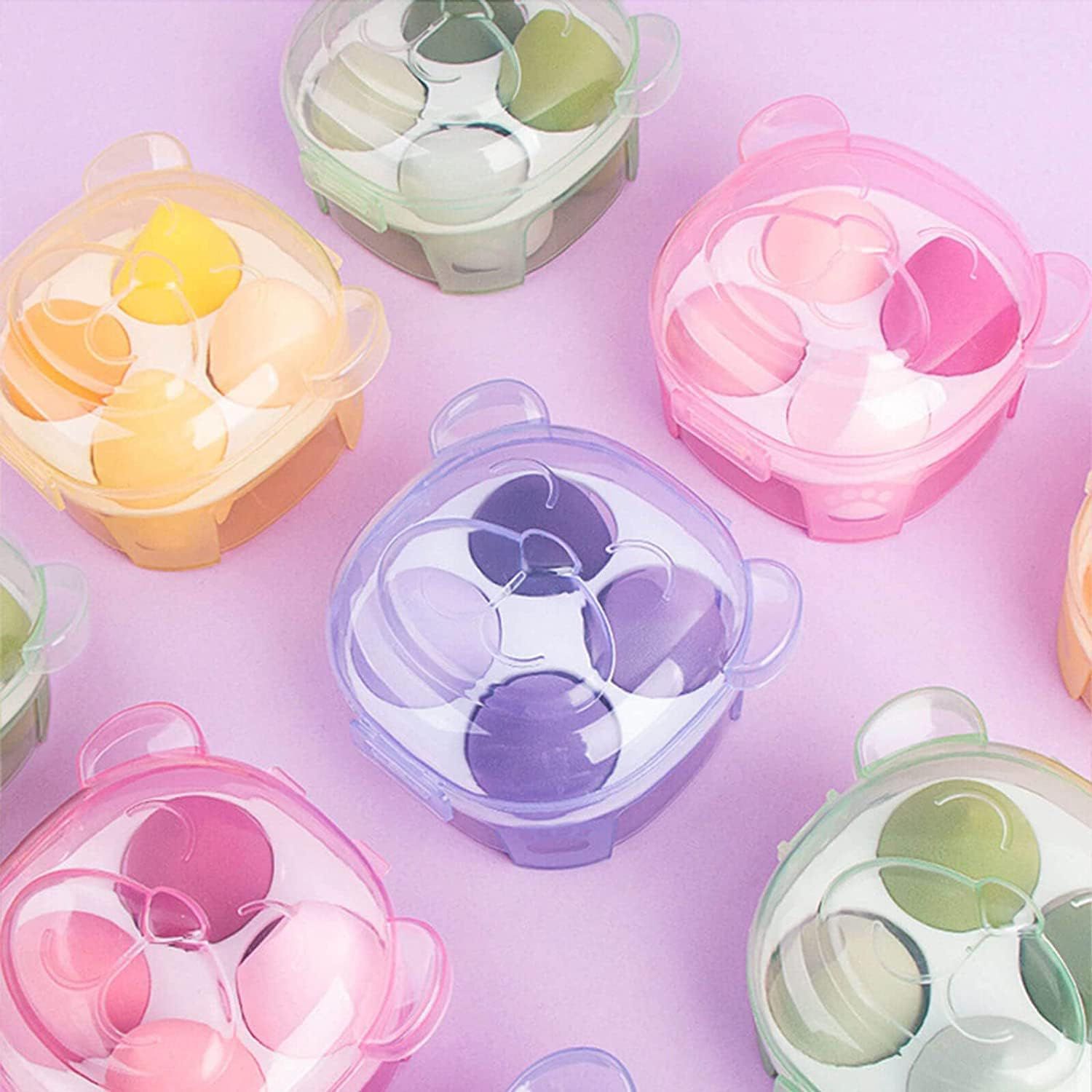 Makeup sponges or beauty blenders in bear-shaped storage boxes.